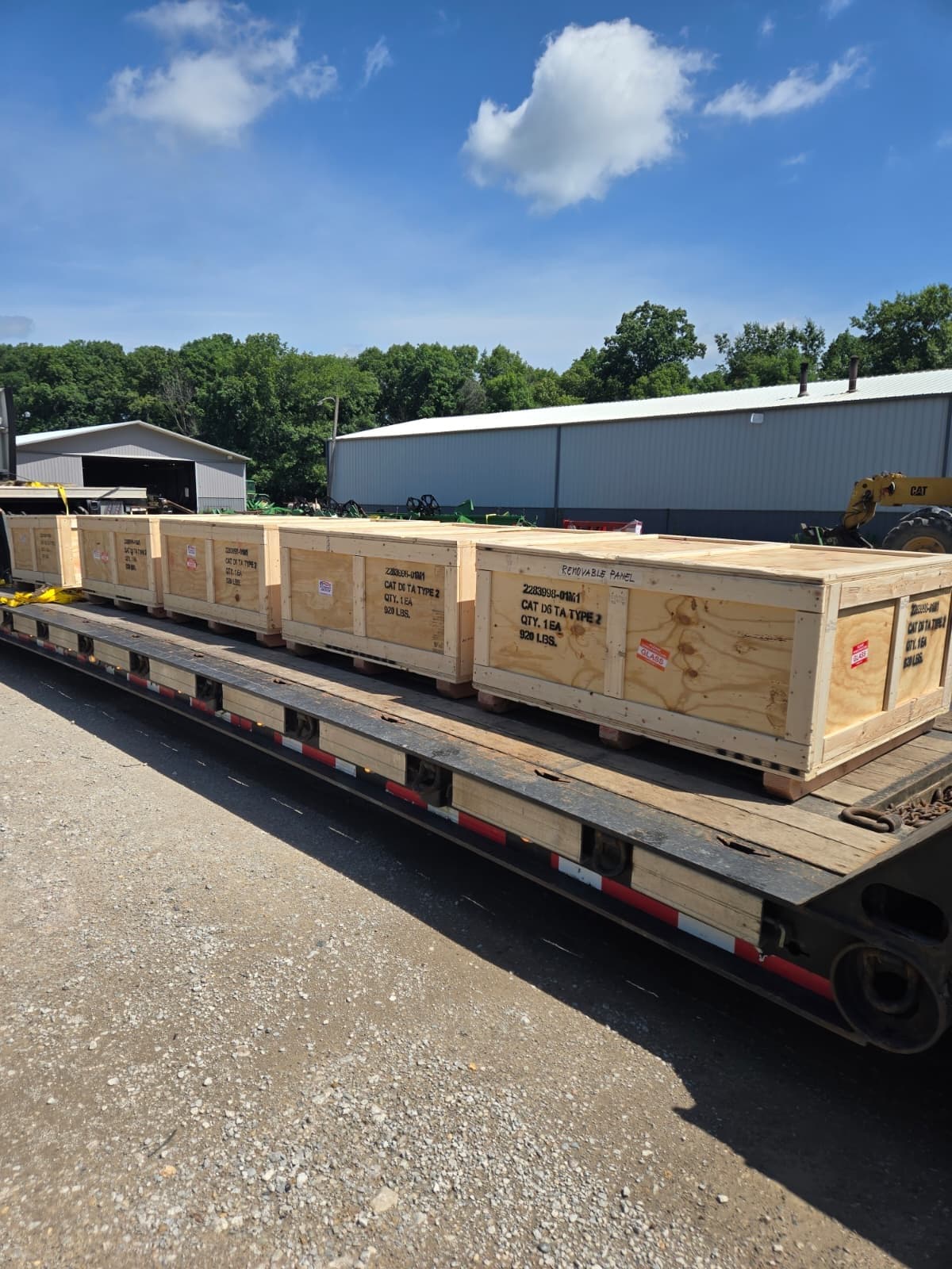 Each crate labeled with part number, quantity, and weight before pickup
