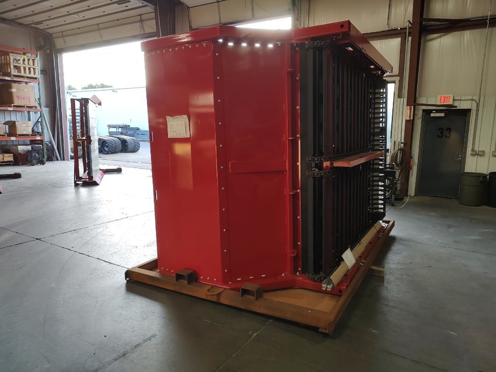 Main frame section blocked on its shipping skid, panel side out