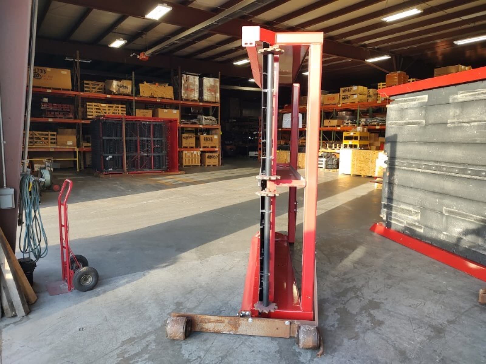 Conveyor/elevator section stood upright on its skid, ready for crating