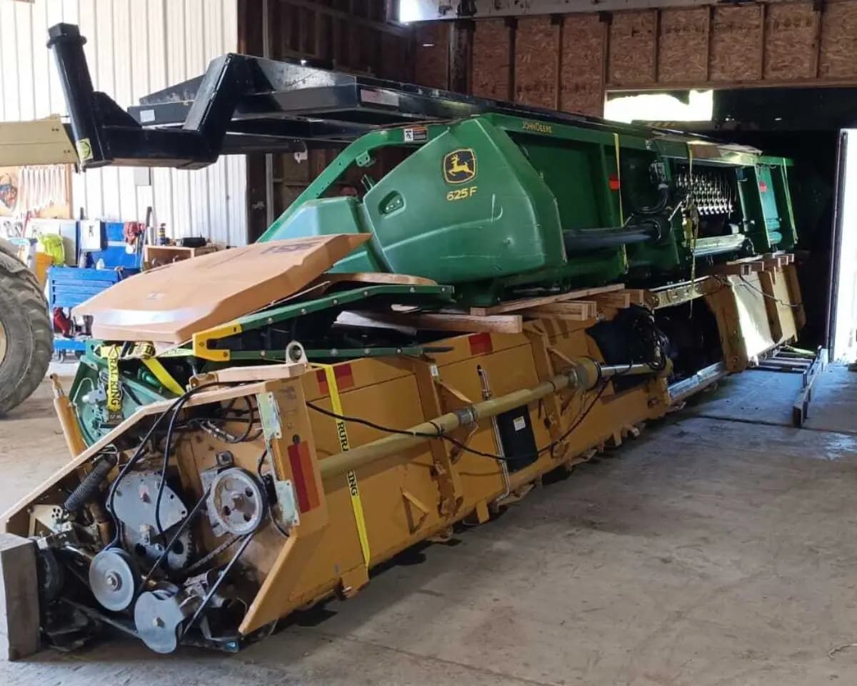 Cargo strapped to stands and staged after container destuffing.