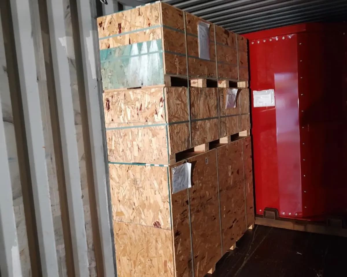 Labeled machinery components staged after heavy equipment dismantling.