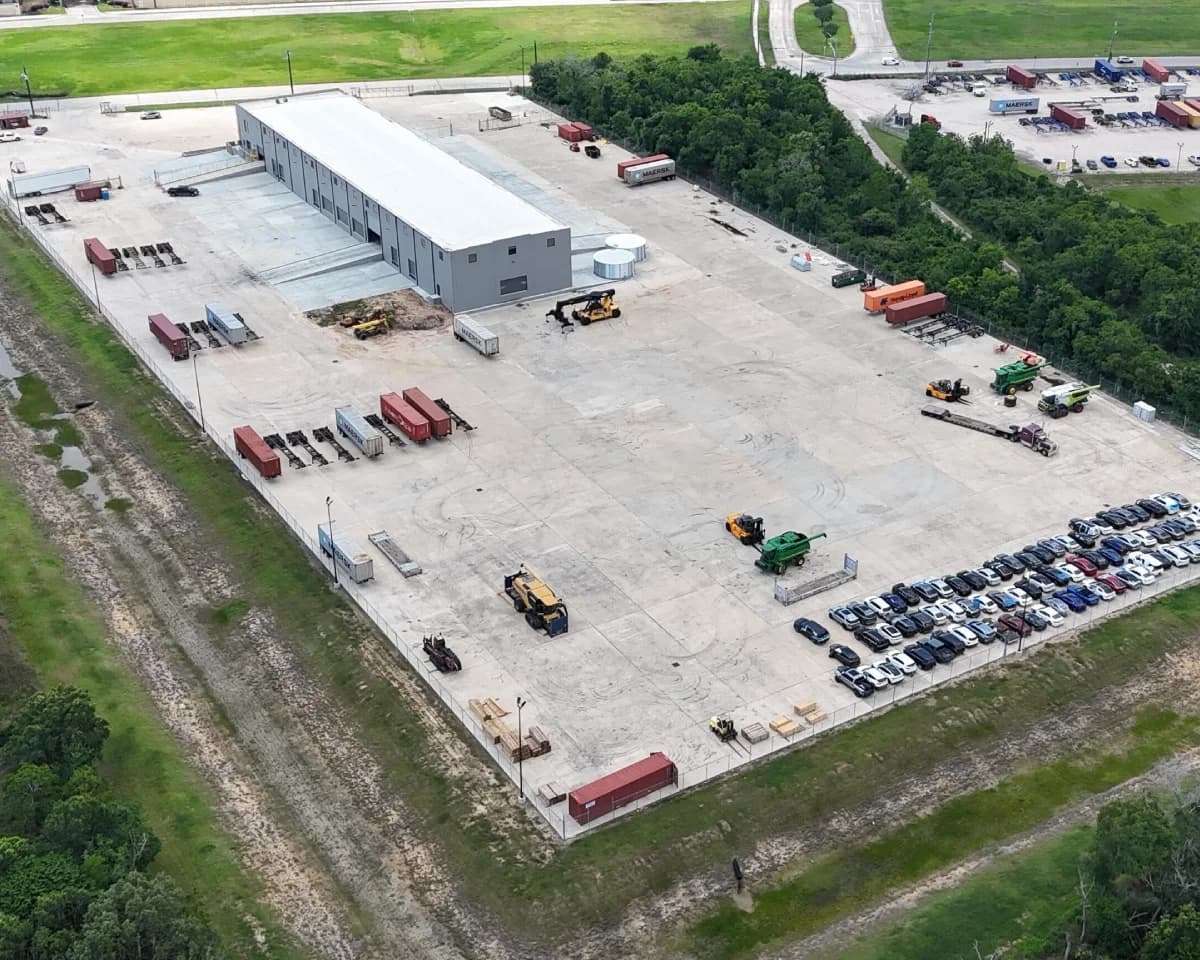 Heavy equipment staged in Houston storage yard.