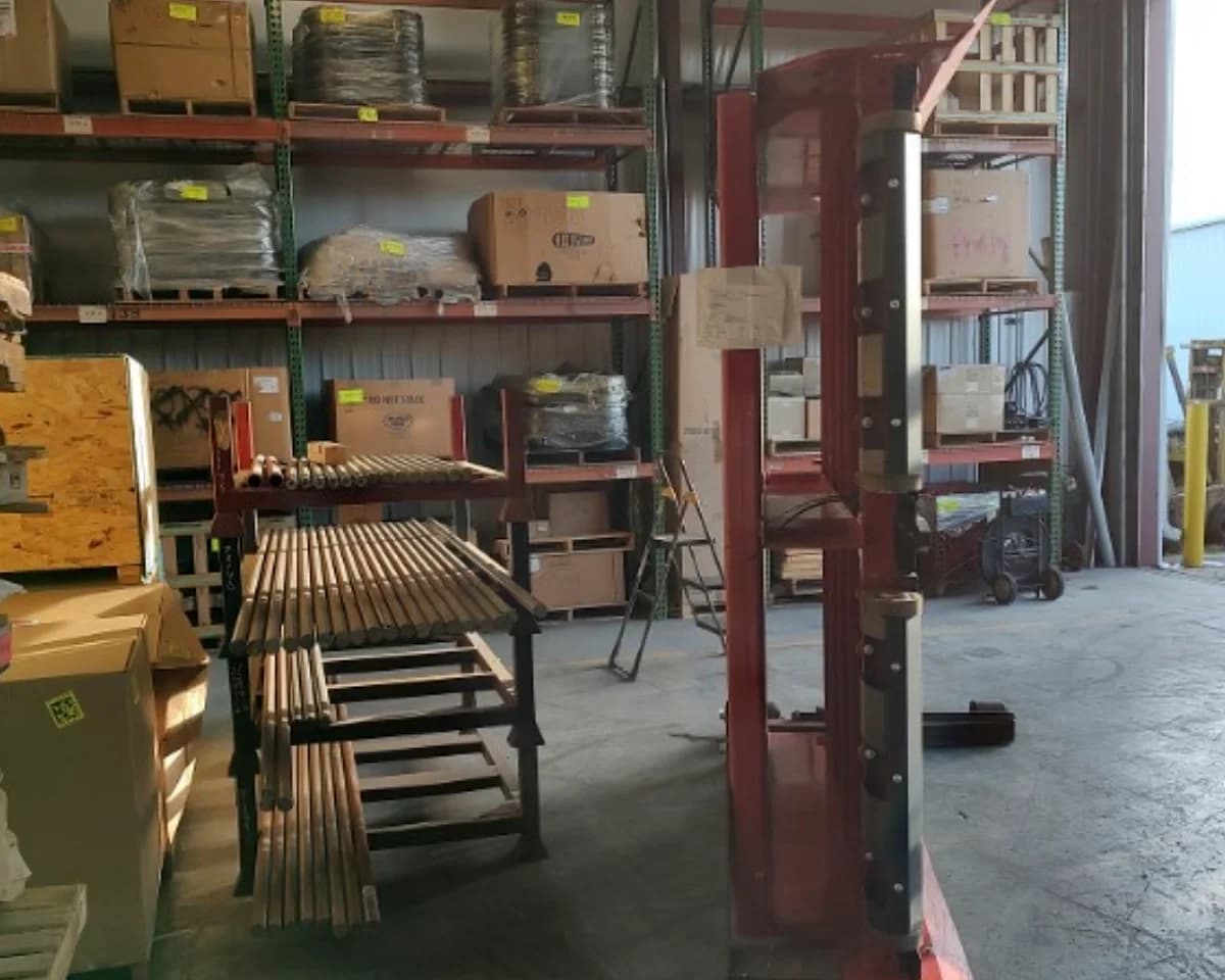 Machinery components stored indoors at Houston facility.