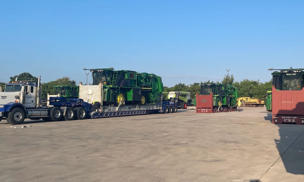 Rows of trucks and equipment parked across the storage yard.