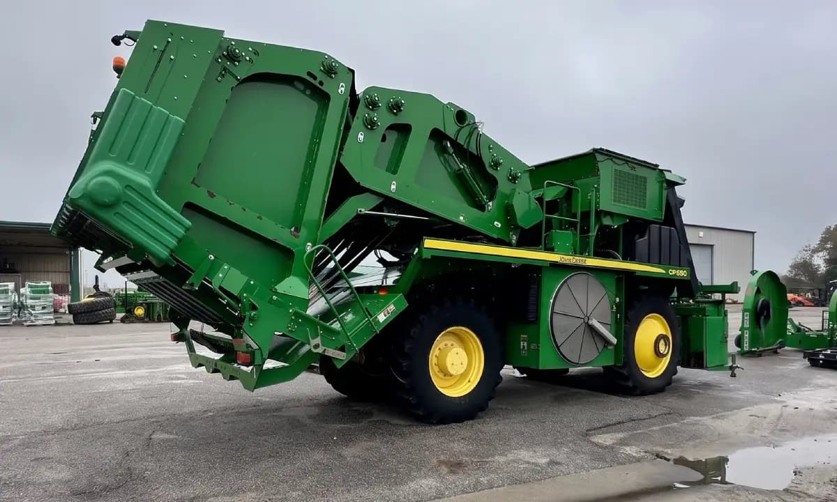 A harvester header on a trailer at the yard.