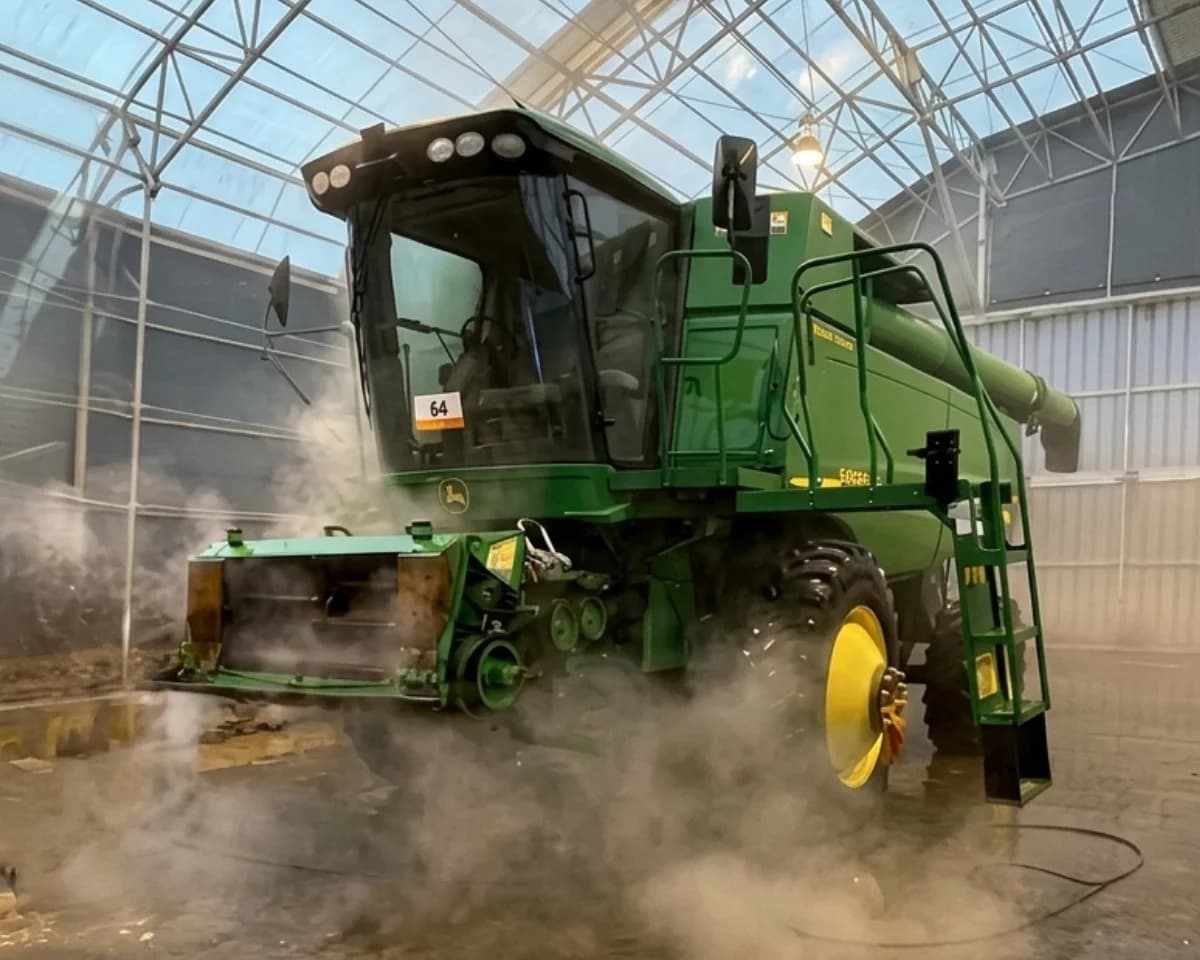 A combine harvester staged beside the treatment building.