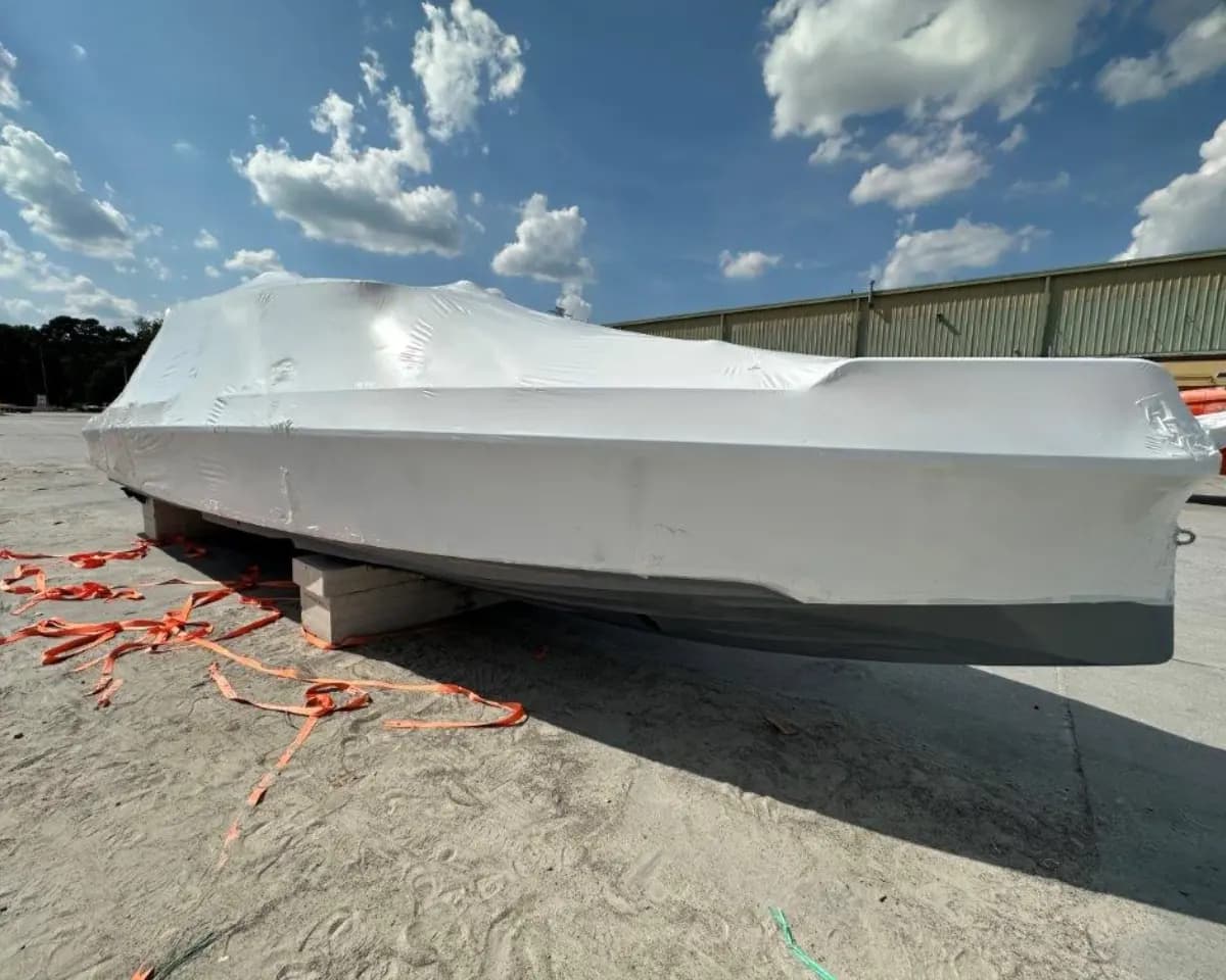 Yacht shrink wrapped before export shipment.